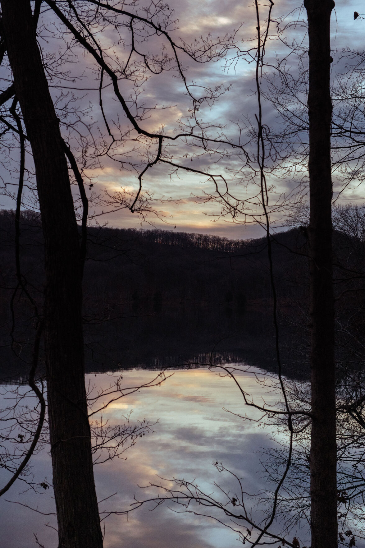 Radnor Lake at sunset, with the sky reflected in the lake's water
